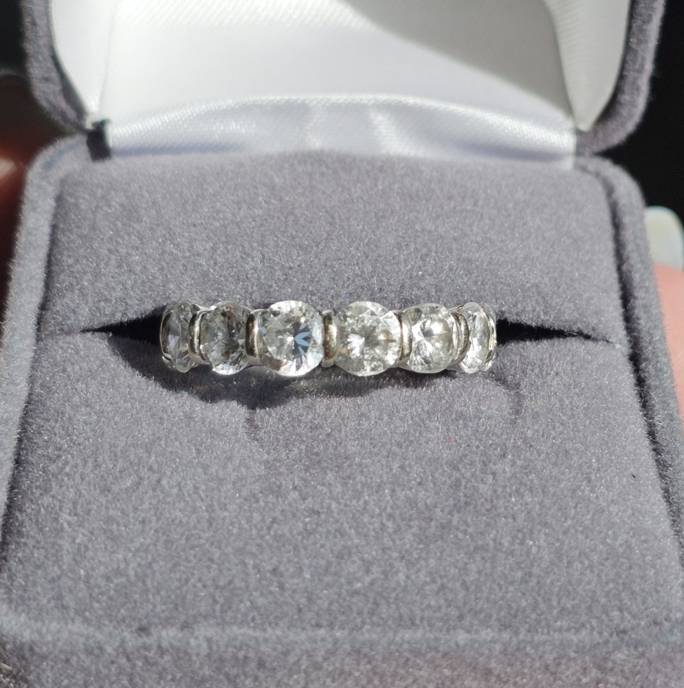 14k white gold CZ eternity band. Substantial weight almost 6 grams. Stamped 14k.